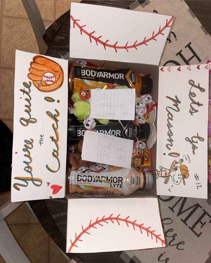 Baseball-themed gift box containing sports drinks and snacks with homecoming proposal messages.