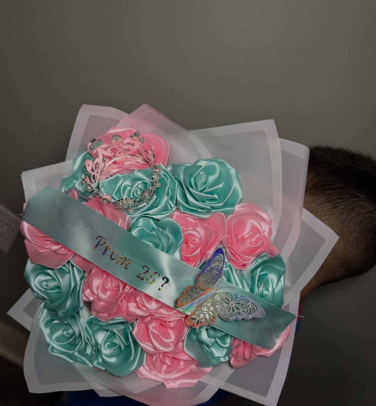 Satin ribbon rose bouquet in pink and teal with a prom proposal ribbon.