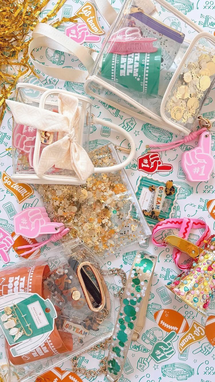 Clear plastic bags and pouches filled with game day accessories on themed background