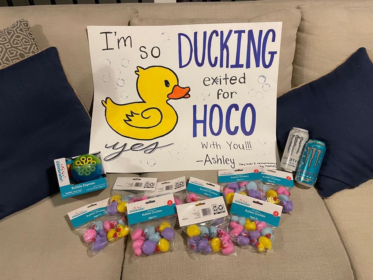 Hoco proposal poster with a rubber duck drawing and bags of small rubber ducks.