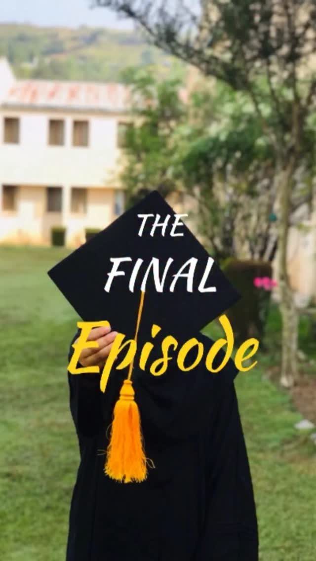 Graduate in black gown holding a mortarboard cap with text over their face