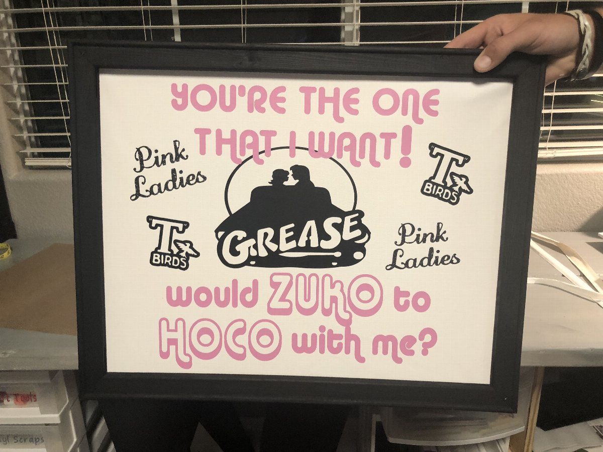 Movie themed hoco proposal poster featuring Grease movie logo and pink text