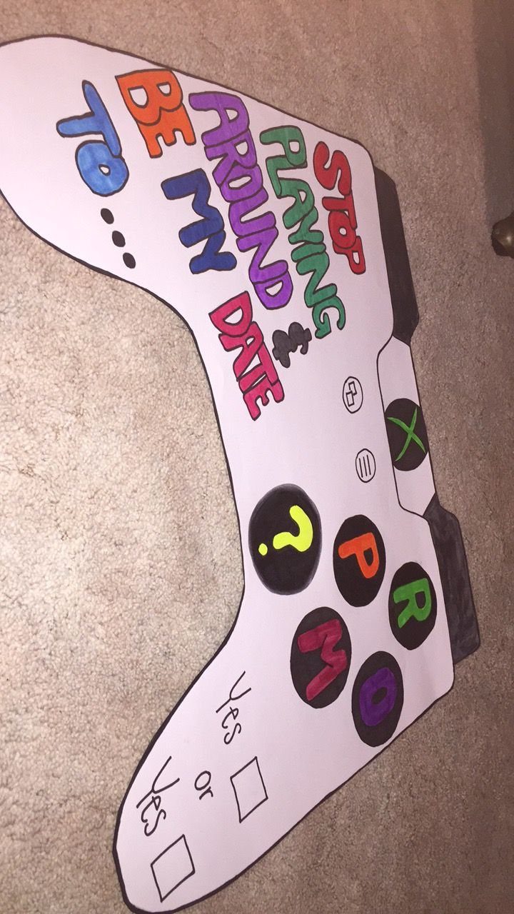 Video game controller shaped poster with colorful text asking someone to be a date.