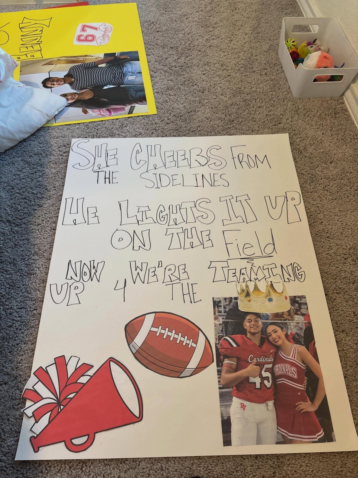 Handmade homecoming poster with a couple's photo, football, megaphone, and crown cutout.