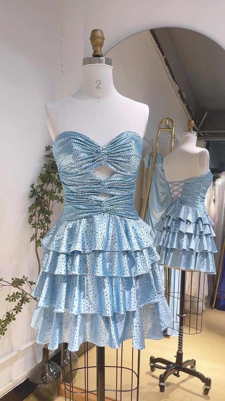 Light blue tiered short dress with a corset back on white mannequins
