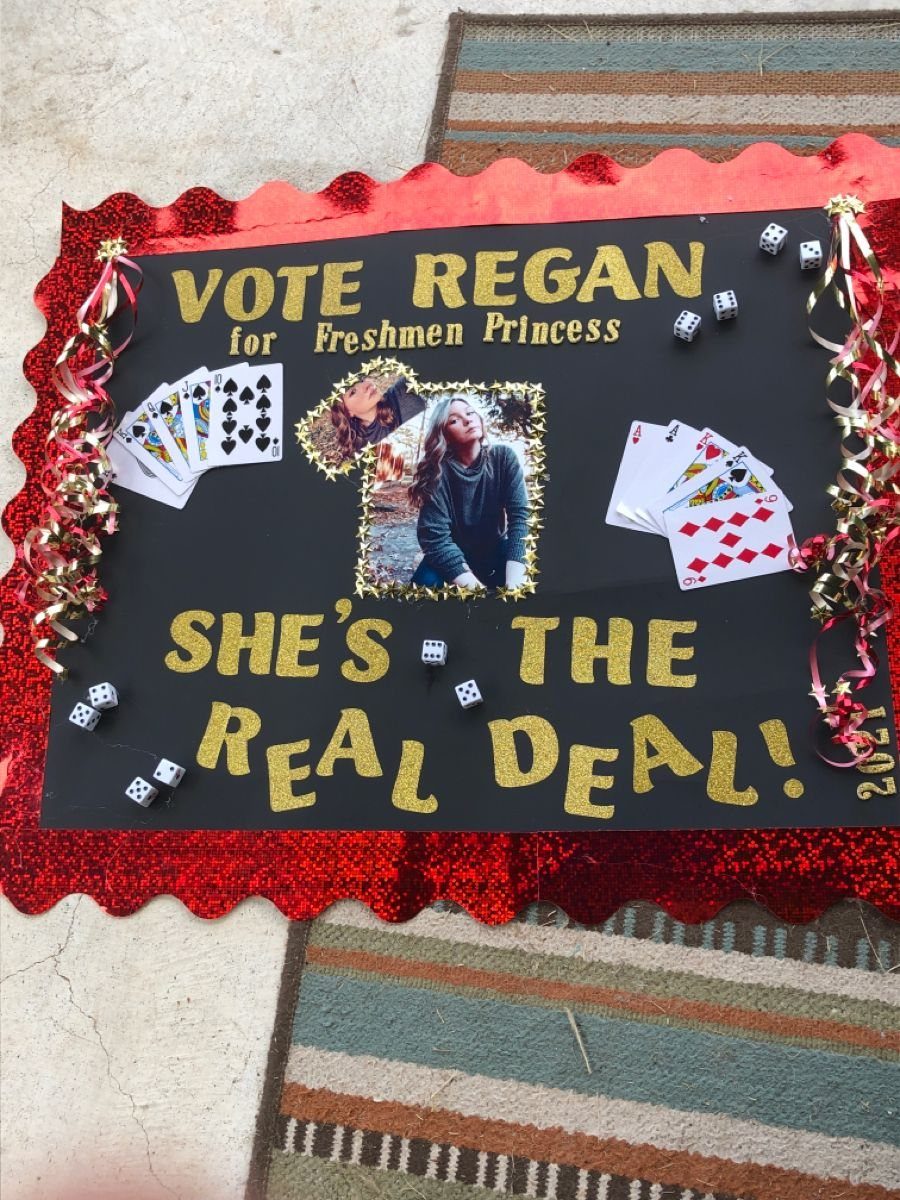 Black campaign poster for Freshmen Princess with red glitter border and playing cards.
