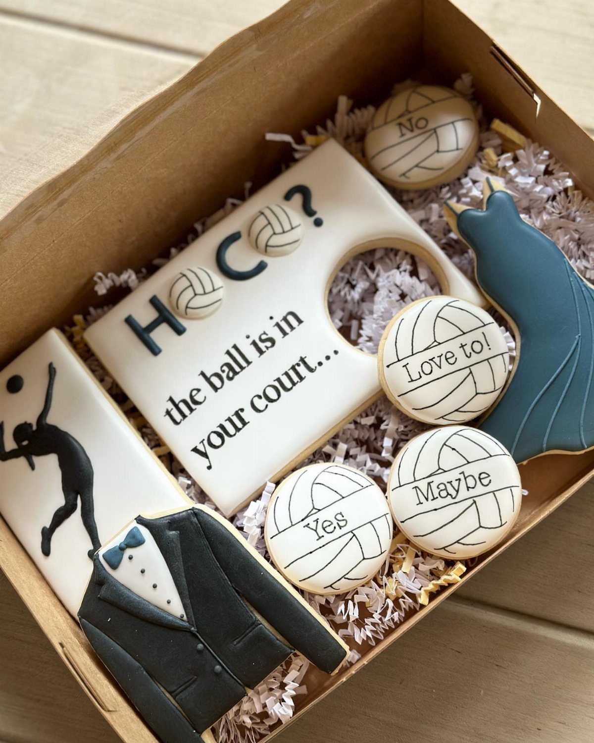Custom sugar cookies in a box for a volleyball themed homecoming proposal