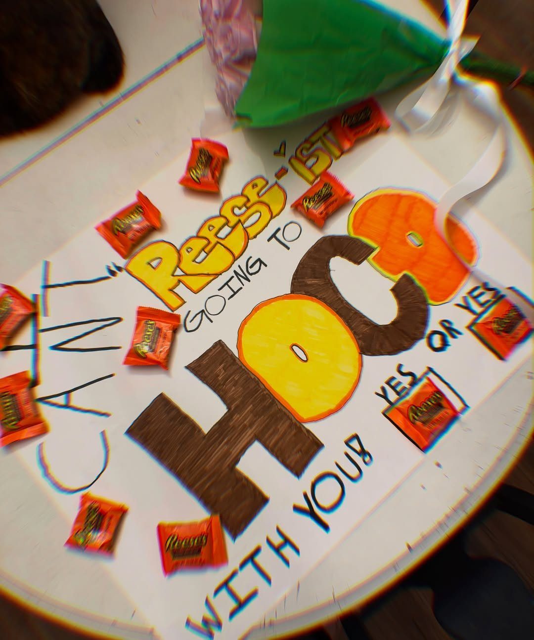 Homecoming proposal poster with Reese's candy bars and colorful hand-drawn lettering.