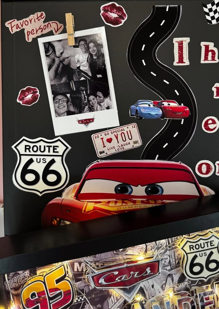 Lightning McQueen themed promposal board with photos, road graphics, and love notes.