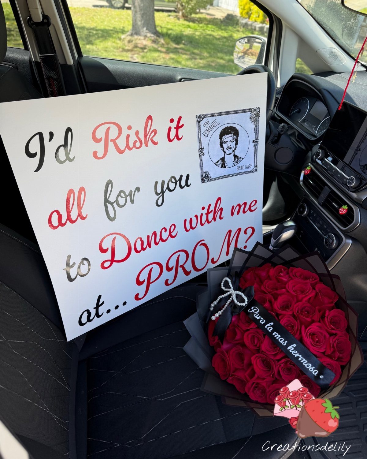 Prom asking poster and red rose bouquet sitting on a black car seat.