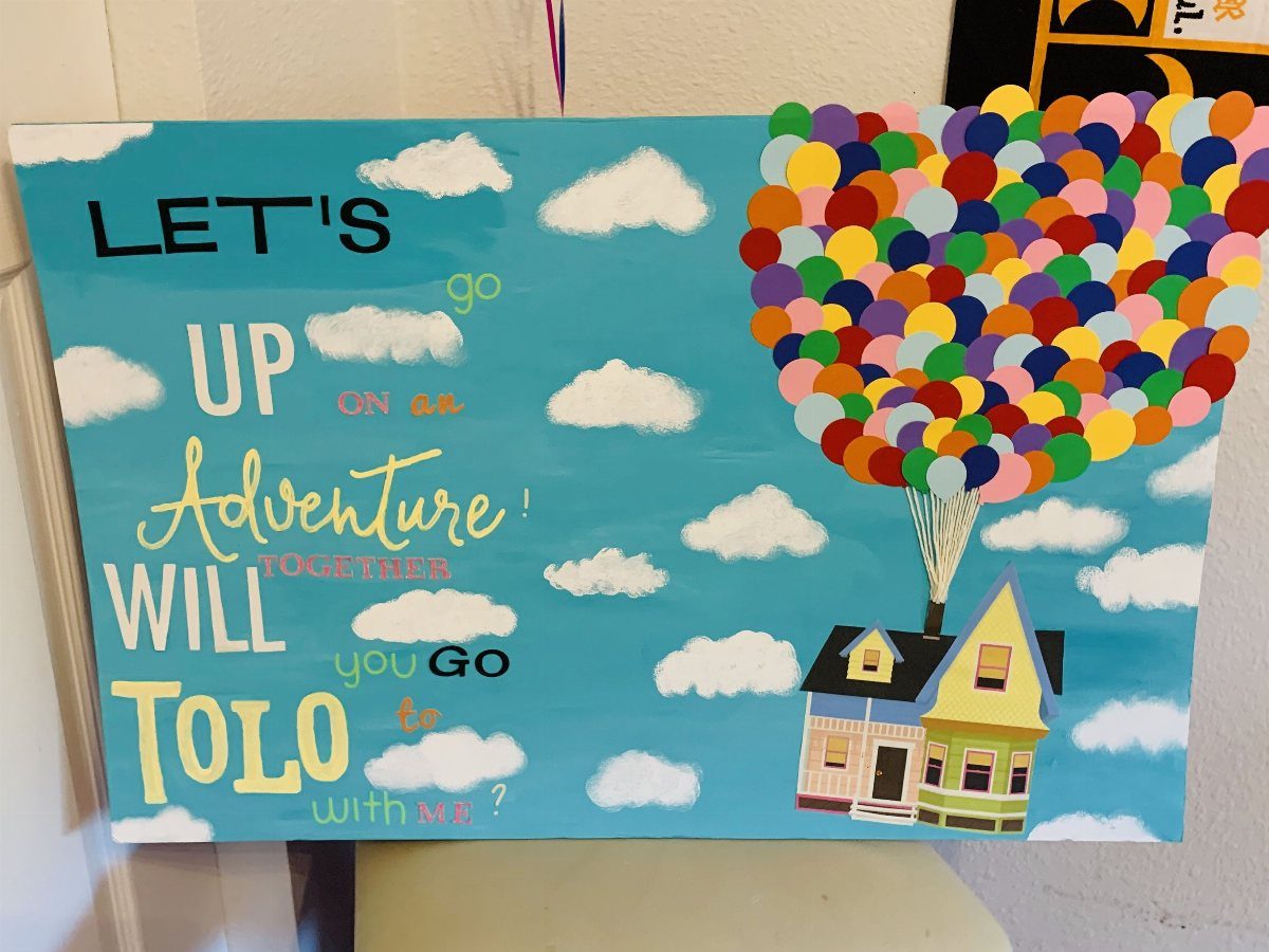 Hand-painted Up movie themed promposal poster with a house and colorful balloons