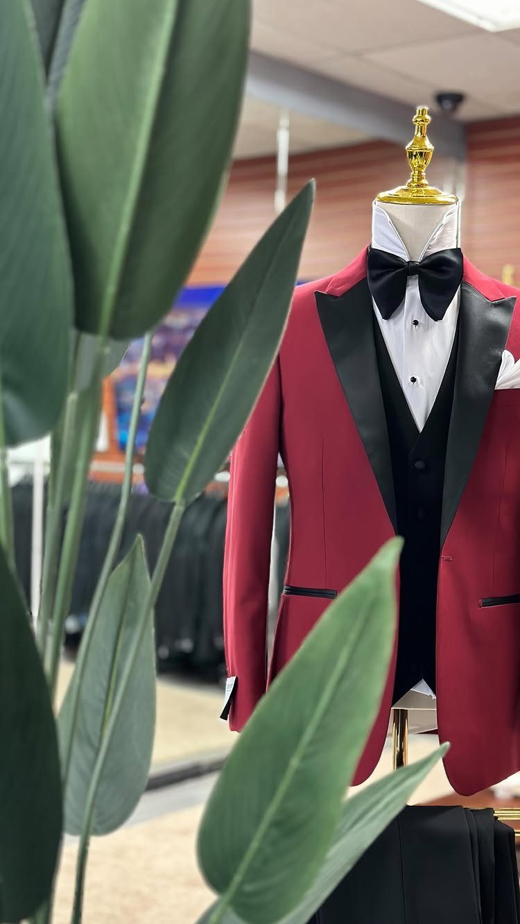 Red tuxedo jacket with black lapels and bow tie on a mannequin