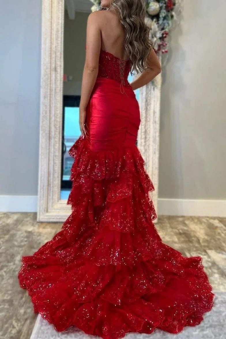 Strapless red satin mermaid gown with a tiered ruffled glittery skirt