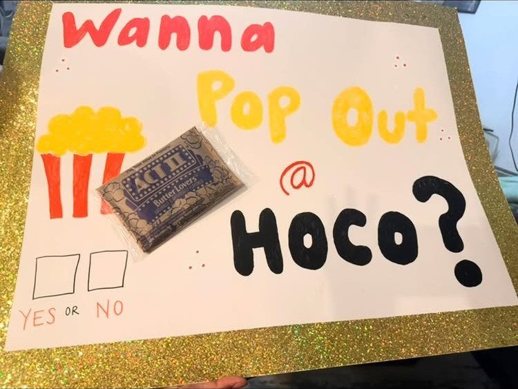 Homecoming proposal poster with popcorn drawing and a real bag of popcorn attached.